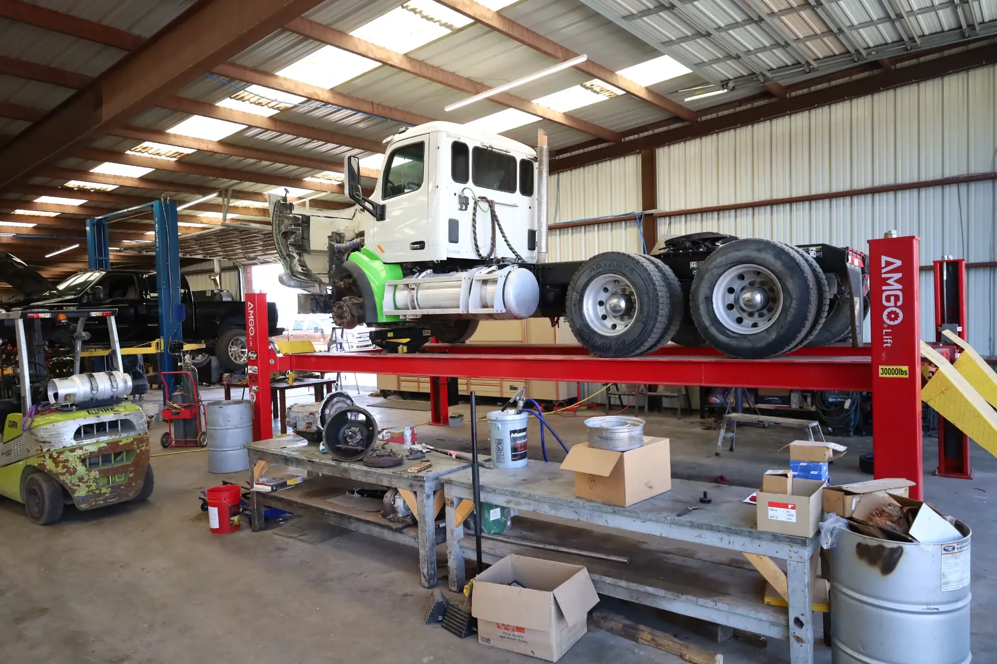 Technician repairing a semi diesel truck in Midlaand TX providing engine diagnostics & repair services