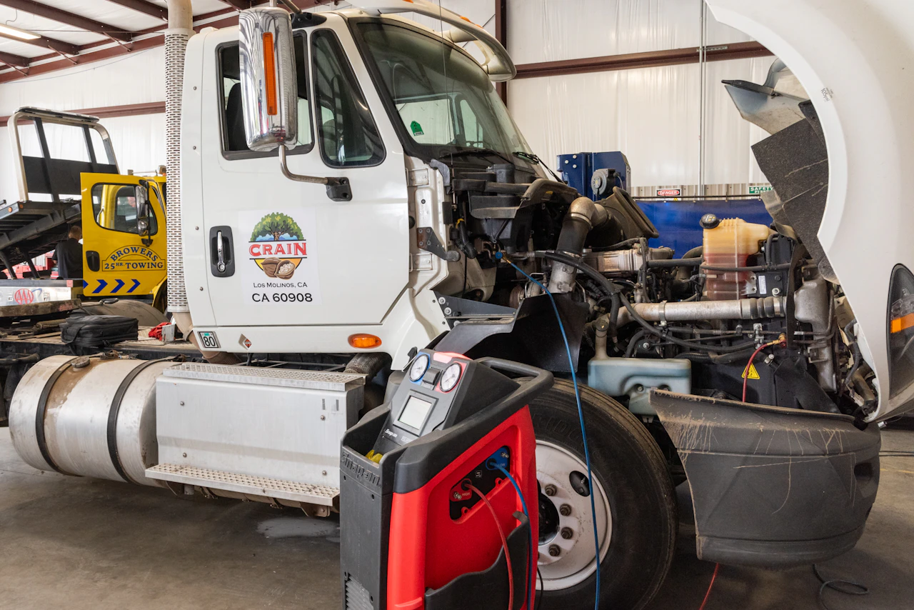 AC machine connected to a truck with gauges at Chris's Diesel Service in Midland TX