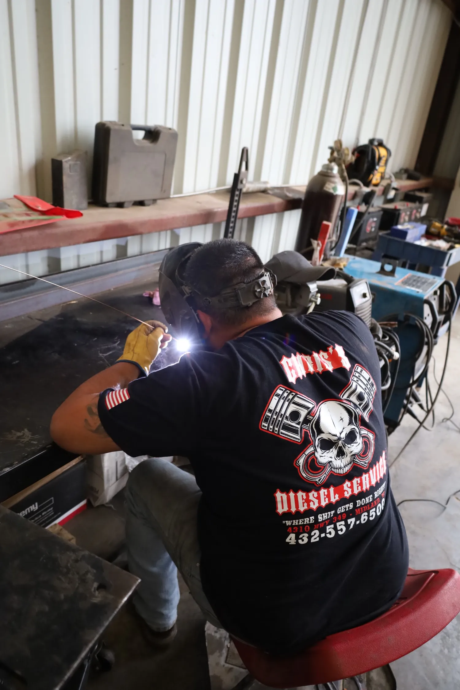 Certified welder performing custom metal fabrication & welding repair in Midland TX diesel workshop