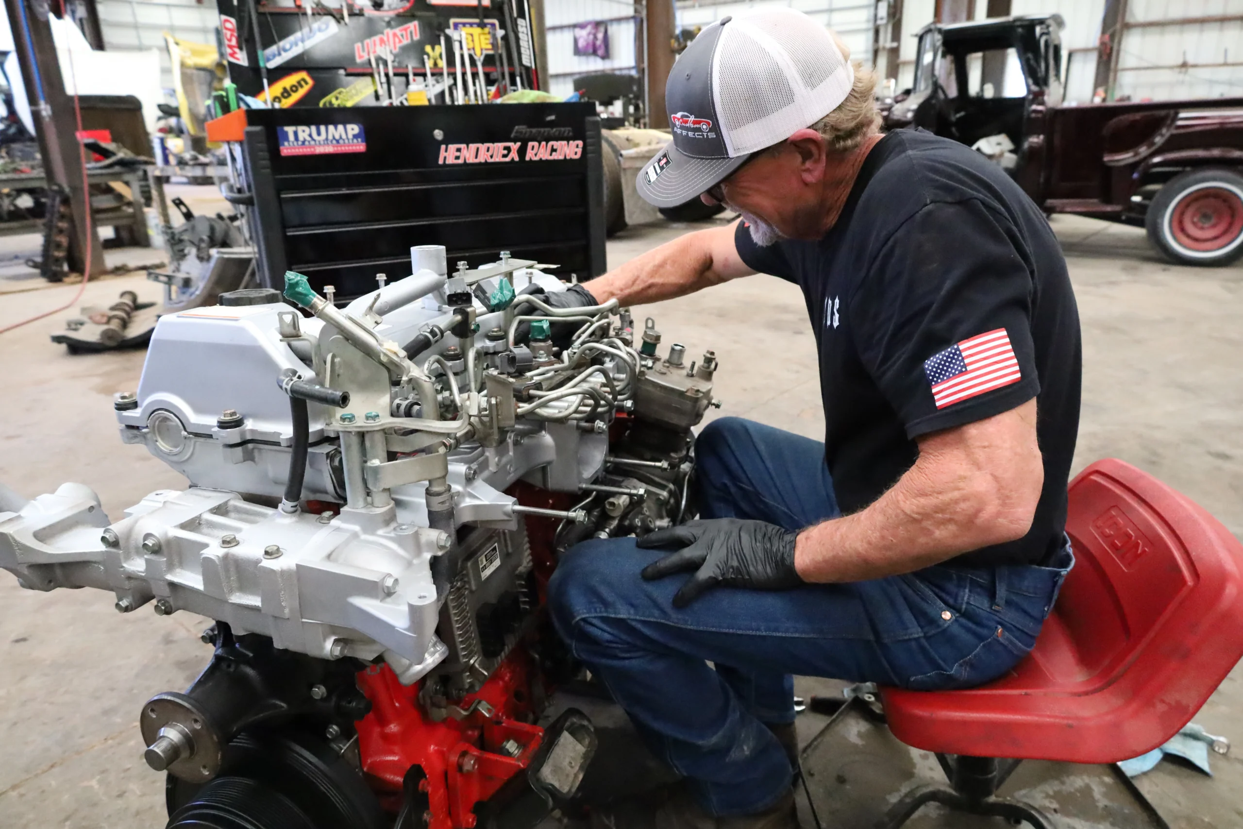 Technician performing in-shop diesel engine rebuild at Chris's Diesel Service Midland Texas