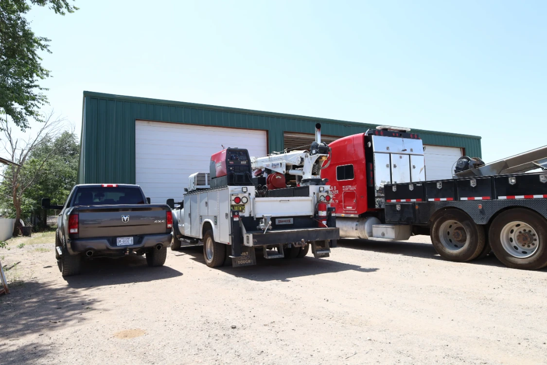 Chris's Diesel Service field service truck and customer vehicles outside repair shop in Midland TX