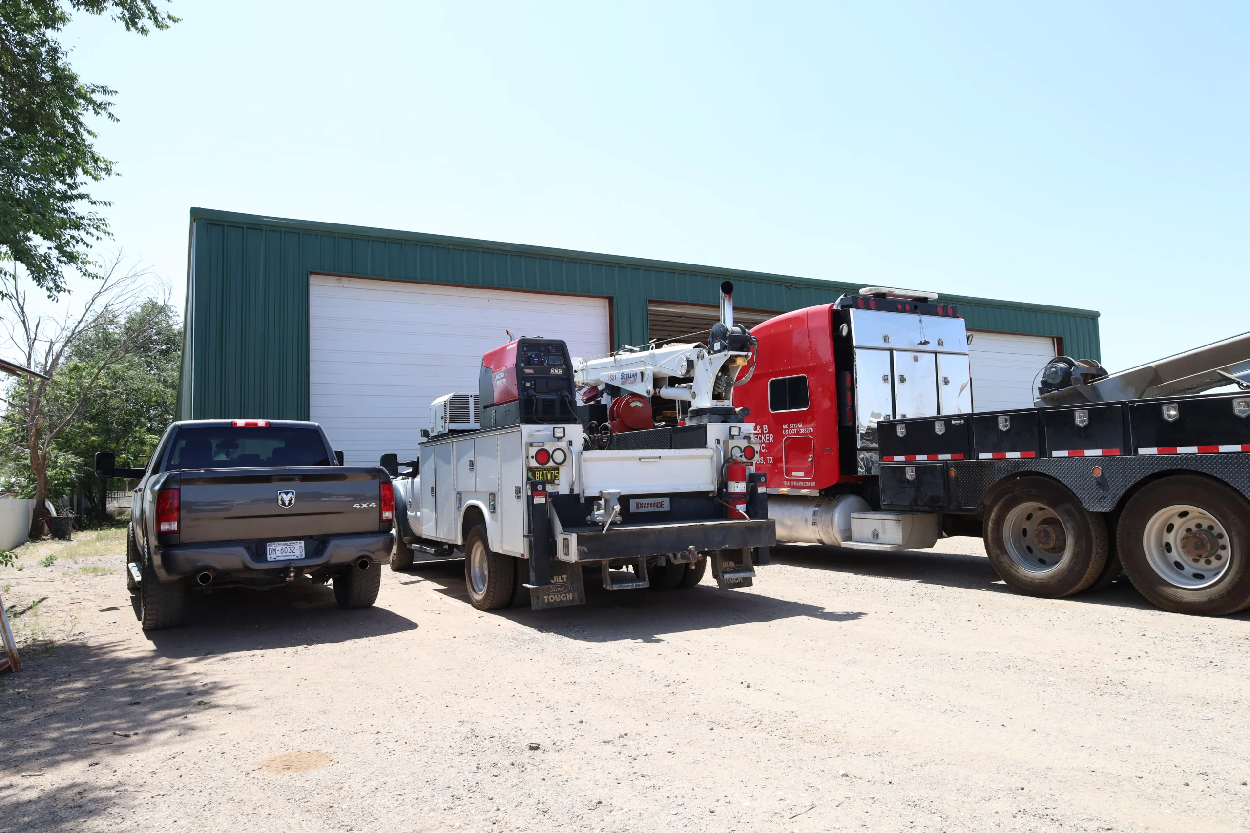 Chris's Diesel Service field service truck and customer vehicles outside repair shop in Midland TX