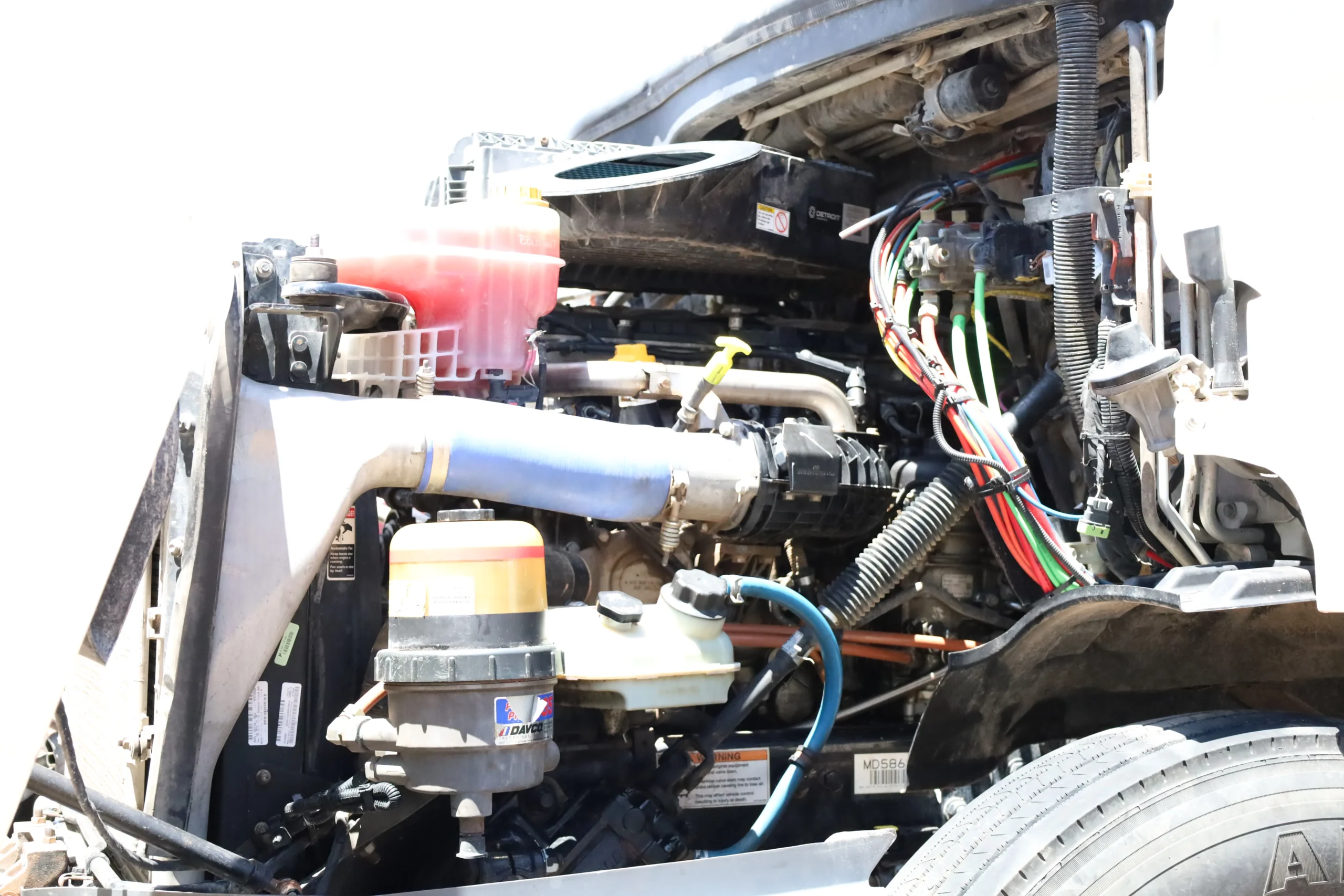 Detroit diesel engine bay showing DEF system and emissions components in Midland TX