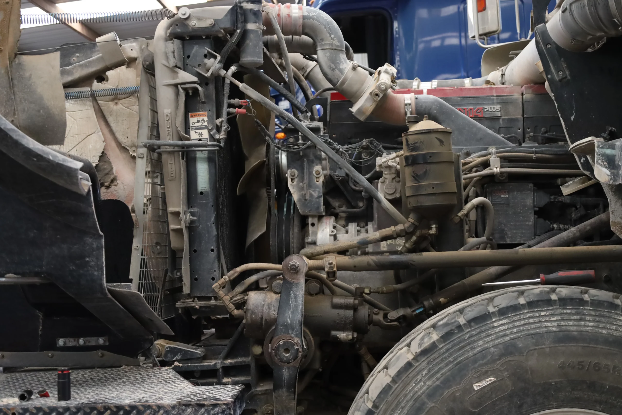Heavy truck engine bay open for turbocharger inspection at Chris's Diesel Service Midland TX