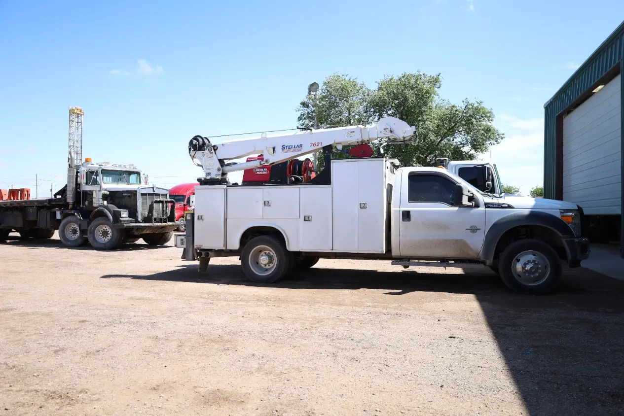 Crane service truck with onboard welder used for mobile heavy equipment repair across the Permian Basin near Midland TX