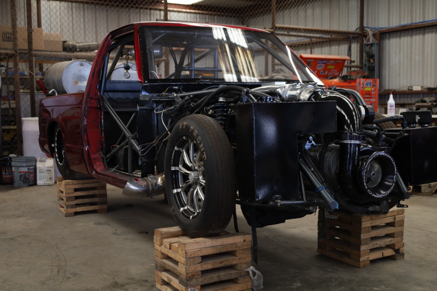 Custom tube chassis race truck with fabricated roll cage and mounting structures at Chris's Diesel Service in Midland, Texas