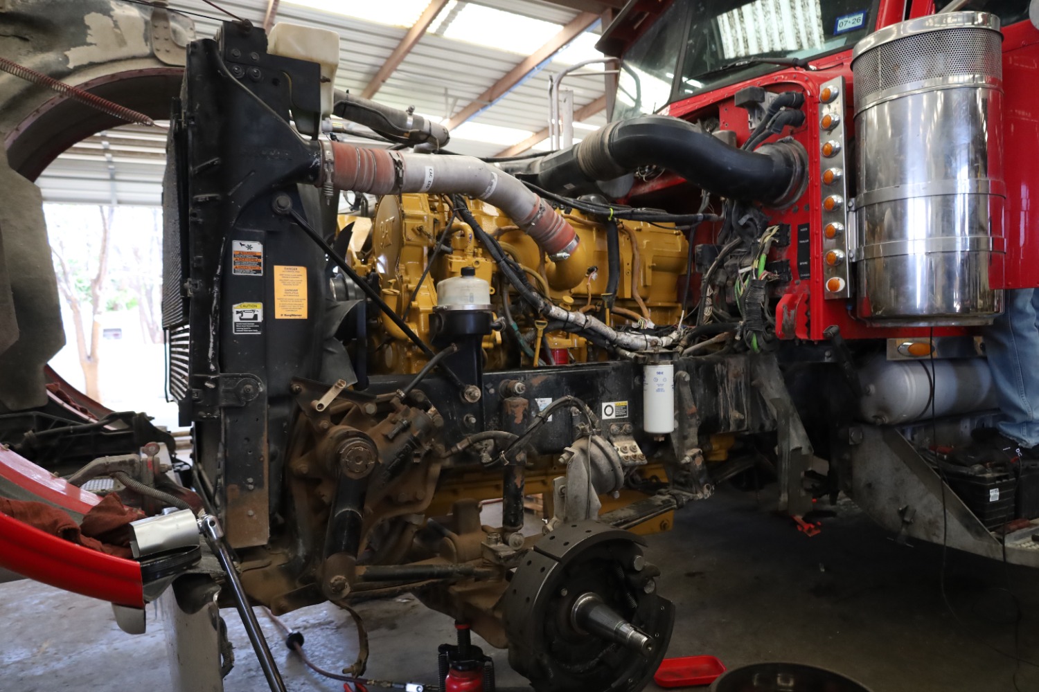 Diesel truck disassembled for engine and front end work in the shop at Chris's Diesel Service in Midland, Texas