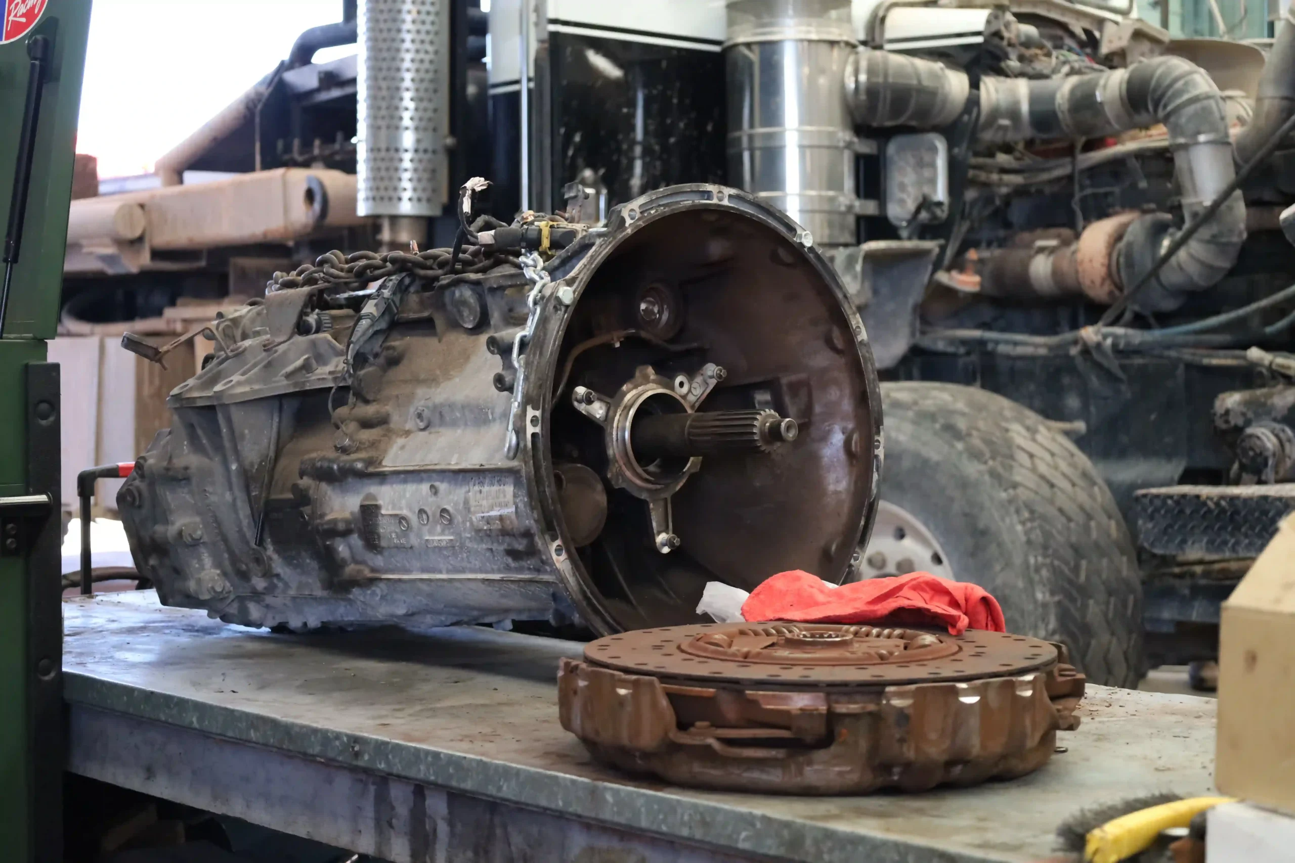 Diesel truck transmission and worn clutch on the bench at Chris's Diesel Service in Midland TX